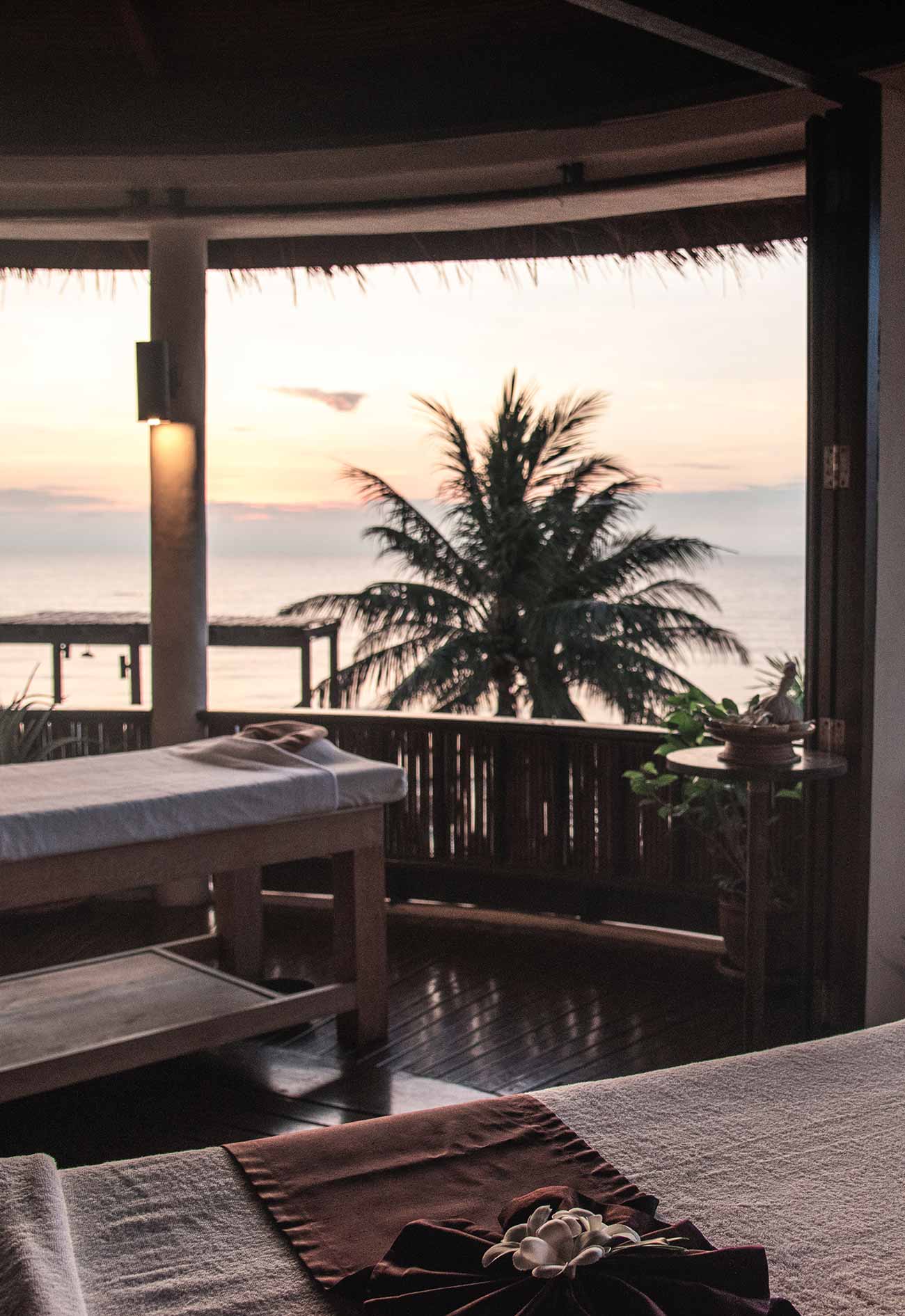 A view of the ocean from an outdoor dining area.