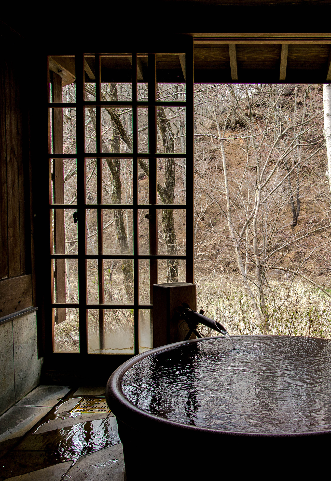 A view of a window and the outside of a building.