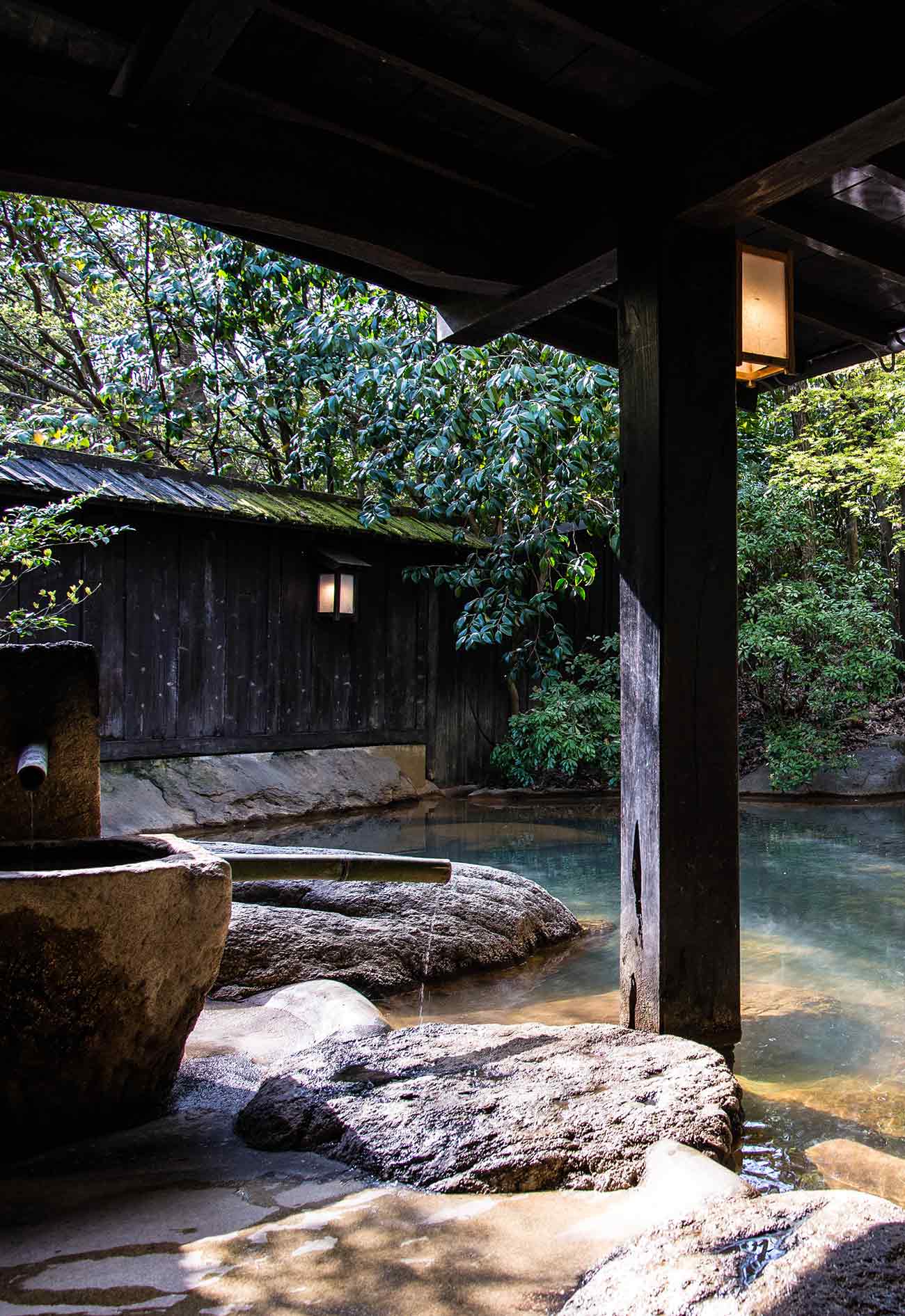 A wooden structure sitting in the middle of a river.