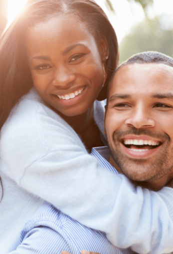 A man and woman smiling for the camera.
